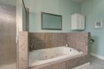 Upstairs master ensuite, dual vanities, shower, and jetted tub